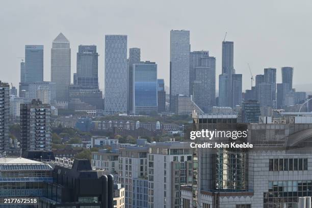 General view of the Docklands Canary Wharf skyline on a hazy day from The Garden at 120 Fenchurch Street on October 7, 2024 in London, United Kingdom.