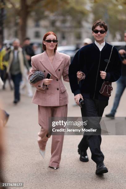Meredith Duxbury is seen wearing black narrow oval sunglasses from Saint Laurent; a rose matching two-piece, consisting of a waisted blazer with...