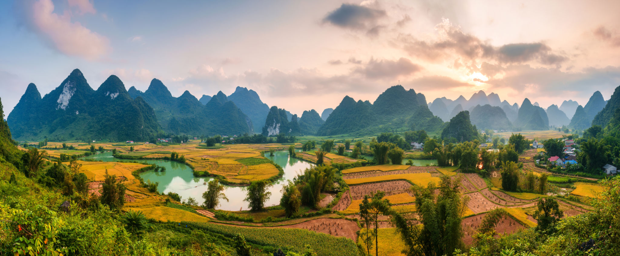Phong Nam Valley with rice field and river flows through traditional village in countryside Phong Nam Valley with rice field and river flows through traditional village in countryside