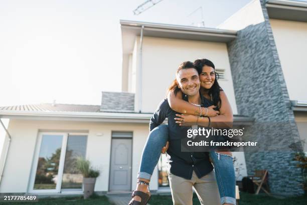 happiness couple enjoying after have bought the new home - mortgage loan stock pictures, royalty-free photos & images
