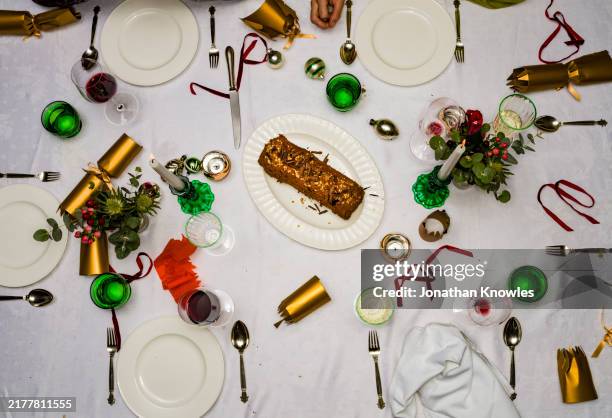 view from above chocolate christmas yule log cake on table - yule log cake overhead stock pictures, royalty-free photos & images
