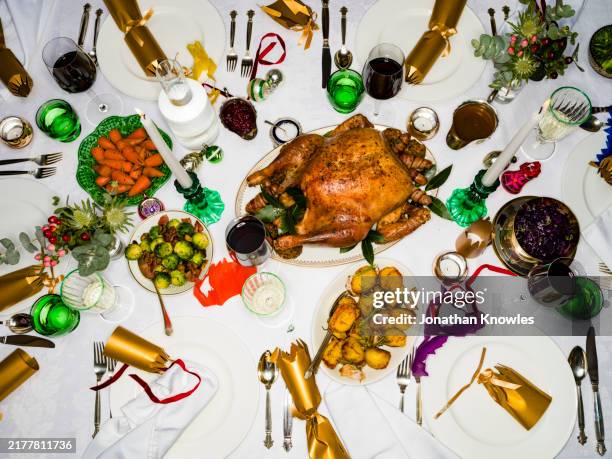 view from above traditional roasted turkey on dinner table - no people stock pictures, royalty-free photos & images
