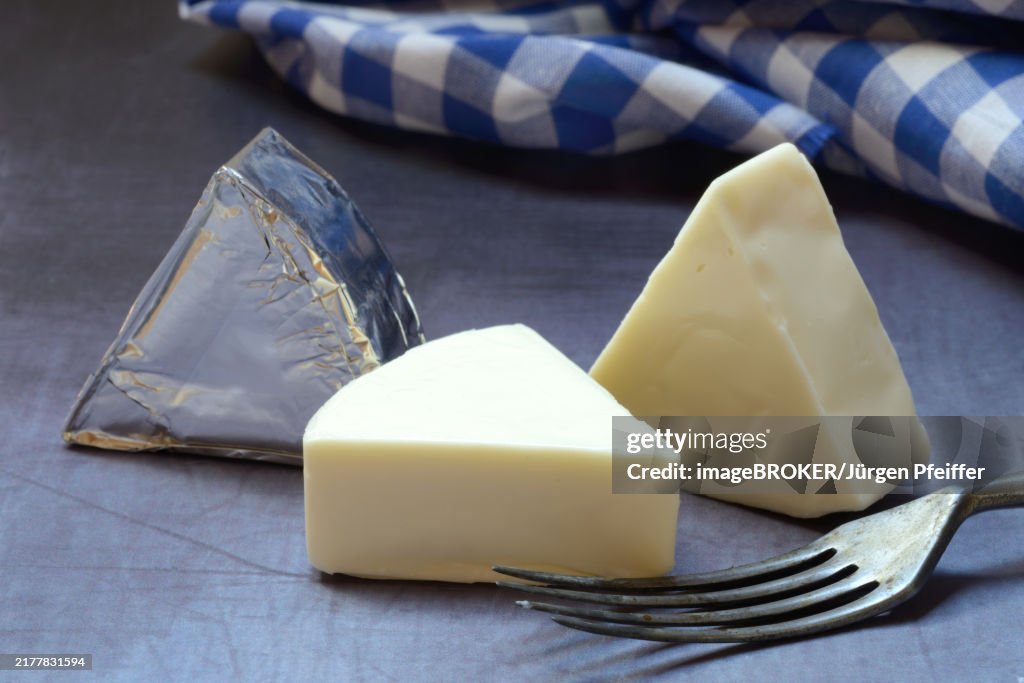 Processed cheese, cheese wedges with fork
