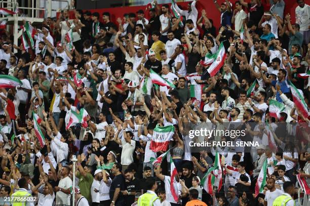 Iran's supporters celebrate a goal during the 2026 FIFA World Cup AFC qualifiers group A football match between Iran and Qatar at the Rashid Stadium...