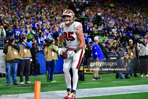 George Kittle of the San Francisco 49ers celebrates after scoring a touchdown during the third quarter against the Seattle Seahawks at Lumen Field on...