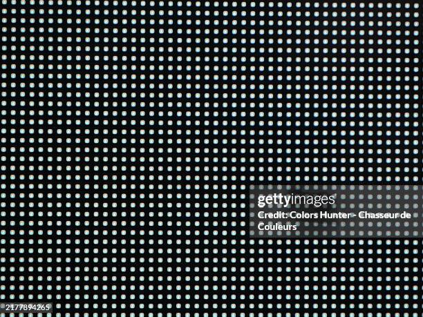 white leds on a black background. macro photography of a bright led screen. natural colors. london, england, united kingdom. - luce led foto e immagini stock