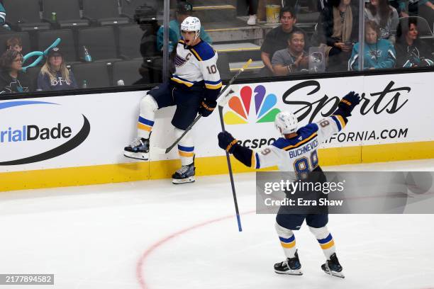 Pavel Buchnevich celebrates with Brayden Schenn of the St. Louis Blues after Schenn scored the game-winning goal against the San Jose Sharks in...