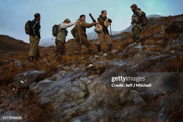 Stalker Christopher McKenzie leads a shooting party on Sgorr Ruadh on the Achnashellach estate in Wester Ross on October 10, 2024 in Lochcarron,...
