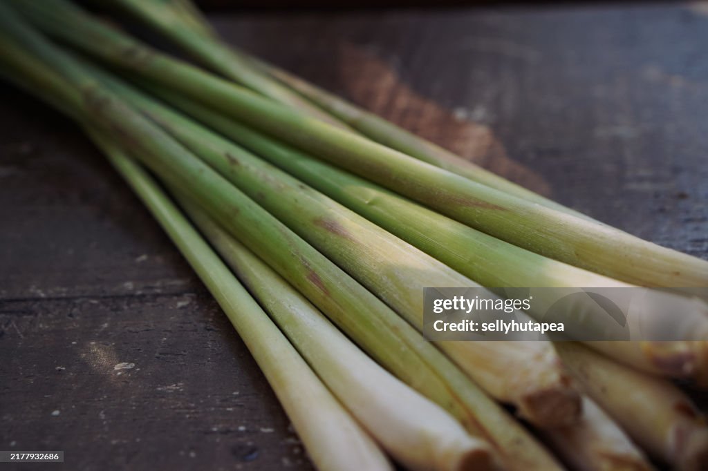 Lemongrass, Cymbopogon Citratus, on woven bamboo or wood table