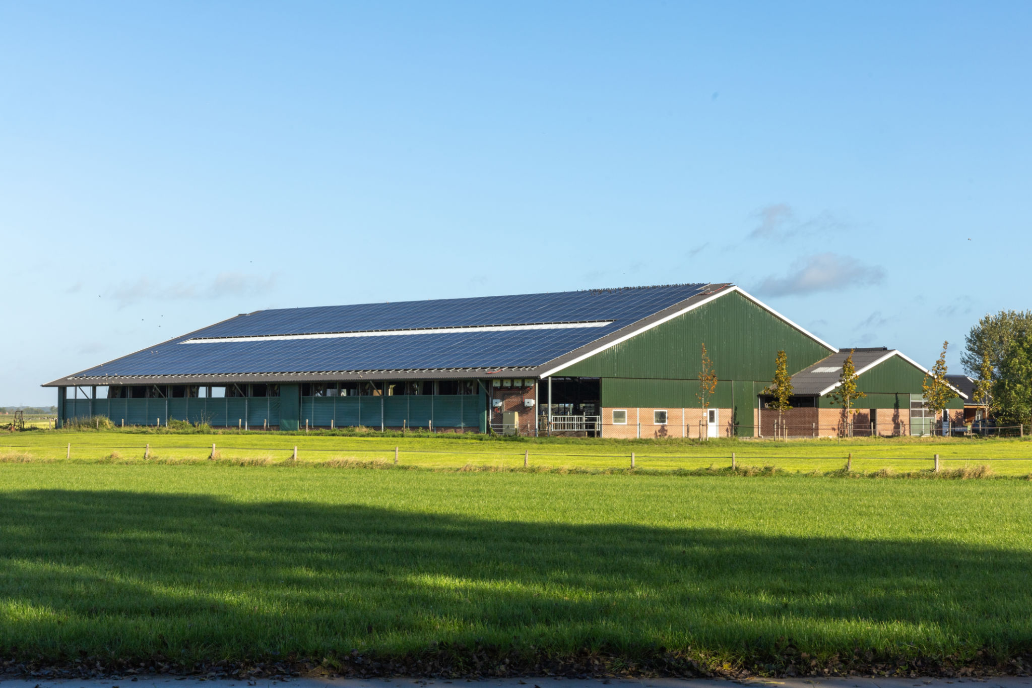 A Dutch farm with solar panels on the roof A Dutch farm with solar panels on the roof