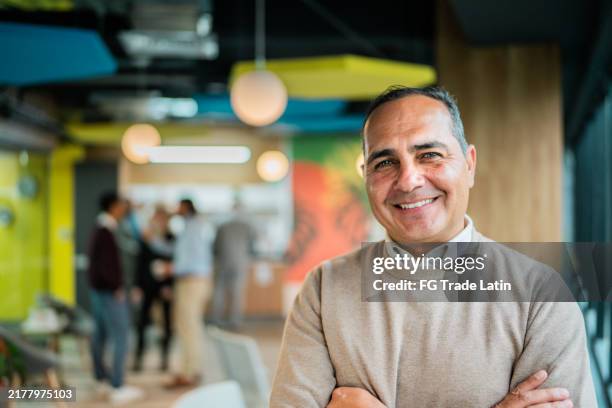portrait of mature businessman at office - generation x stock pictures, royalty-free photos & images
