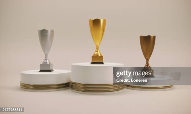 podium mit trophäe - siegerpodest stock-fotos und bilder