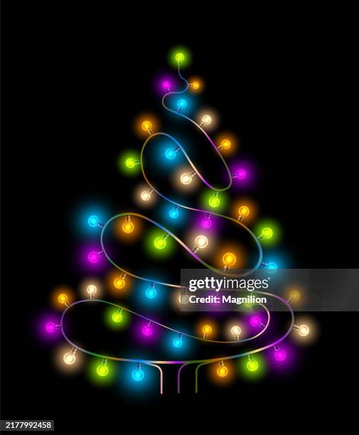 christmas tree shape formed by colorful festive string lights on black background - string lights transparent stock illustrations