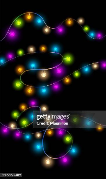 colorful festive string lights on a black background - christmas string lights isolated stock illustrations