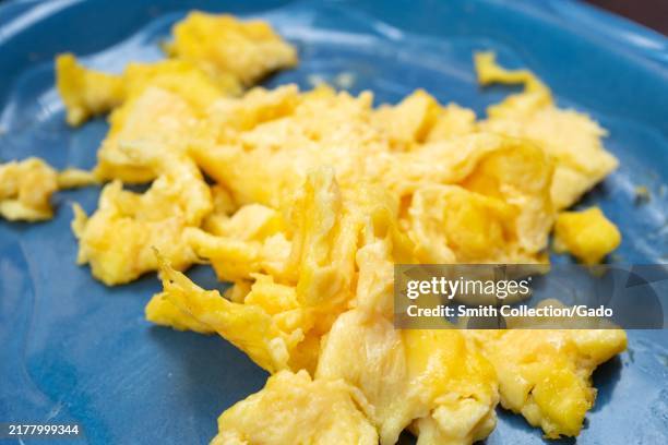 Close-up of scrambled eggs on a blue plate at the Breakfast Club restaurant in Lafayette, California, October 4, 2024.