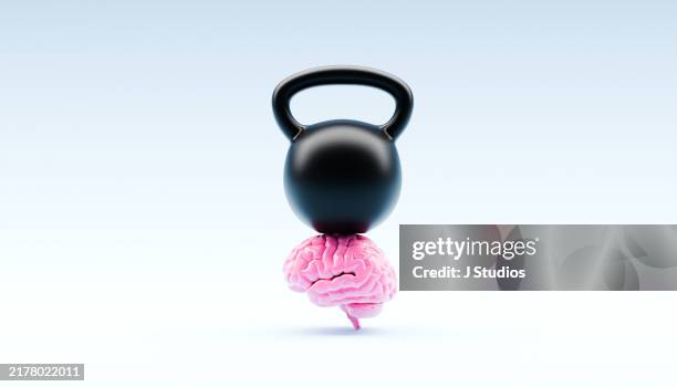 brain with a heavy weight on top - realismo conceptual imagens e fotografias de stock