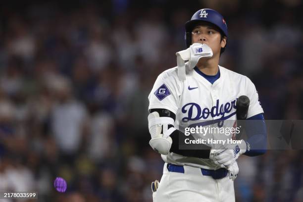 Shohei Ohtani of the Los Angeles Dodgers reacts after striking out against the San Diego Padres during the sixth inning of Game Five of the Division...
