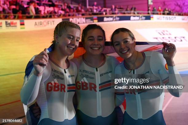 Britain's Sophie Capewell , Britain's Emma Finucane and Britain's Katy Marchant celebrate winning gold after the women's team sprint final race of...