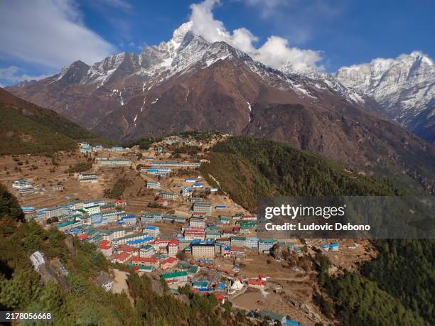 landscape with namche bazar and thamserku mountain in the sagarmāthā national park - namche bazaar stock pictures, royalty-free photos & images