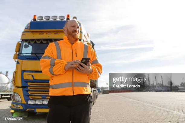 transport worker on site during his daily duties - truck driver stock pictures, royalty-free photos & images