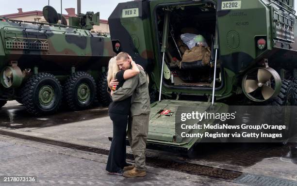 October 16: Christina Ranieri hugs her son Cpl. Alexander Ranieri after a platoon of Amphibious Combat Vehicles returned to Camp Pendleton, CA on...