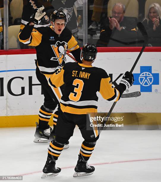 Jesse Puljujarvi of the Pittsburgh Penguins celebrates with Jack St. Ivany after scoring a goal in the second period during the game against the...