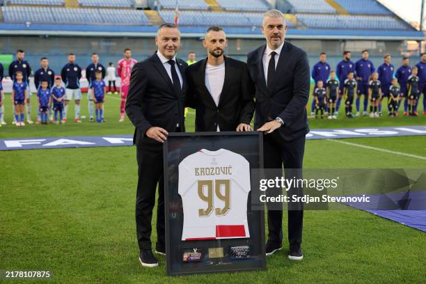 Marcelo Brozovic of Croatia poses for a photo after being presented with a framed shirt celebrating his 99 international caps prior to the UEFA...