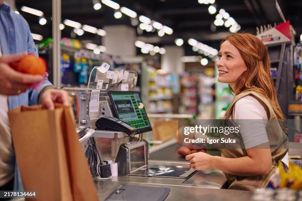 cashier working at a super market - self checkout line stock pictures, royalty-free photos & images