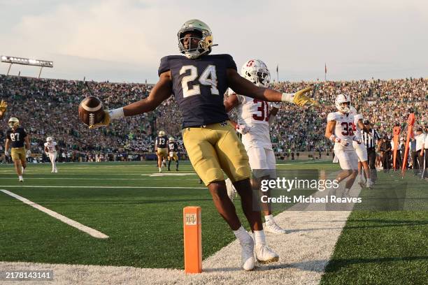 Jadarian Price of the Notre Dame Fighting Irish celebrates a touchdown run against the Stanford Cardinal during the second half at Notre Dame Stadium...
