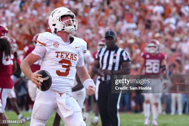 Quinn Ewers of the Texas Longhorns celebrates after scoring a touchdown during the fourth quarter against the Oklahoma Sooners at Cotton Bowl Stadium...