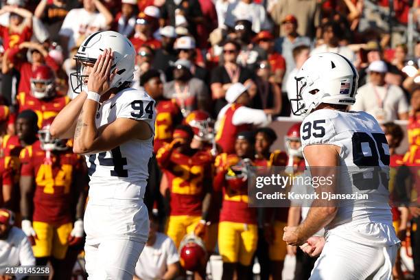 Ryan Barker of the Penn State Nittany Lions celebrates with teammates after kicking a field goal to defeat the USC Trojans 33-30 in overtime at...