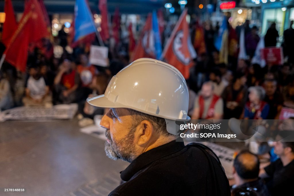 A protester with a miner's hard hat seen during the protest