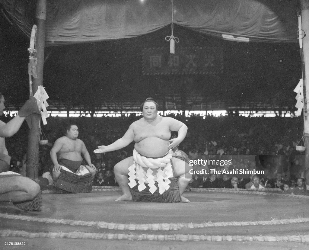 Japanese Ritual Sumo Yokozuna Terukuni performs the Dohyo-Iri, ring purification ritual on ...