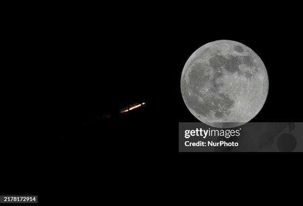 The biggest and brightest supermoon, also known as the Hunter's Moon, rises over the skyline of Doha Corniche in Doha, Qatar, on October 17, 2024.