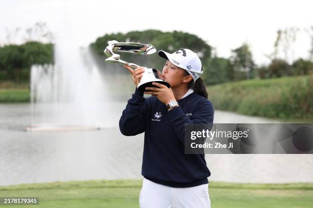 Ruoning Yin of China poses with the trophy after winning the final round of the Buick LPGA Shanghai 2024 at Qizhong Garden Golf Club on October 13,...