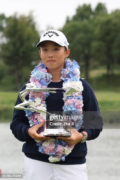 Ruoning Yin of China poses with the trophy after winning the final round of the Buick LPGA Shanghai 2024 at Qizhong Garden Golf Club on October 13,...