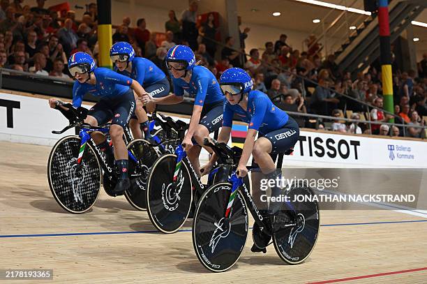 Third placed Italy's team celebrates after the Women's Team Pursuit Finals Race of the UCI Track Cycling World Championships in Ballerup, Denmark, on...