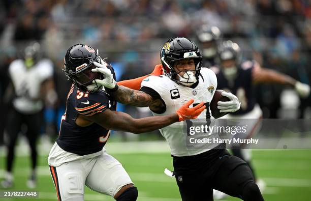 Evan Engram of Jacksonville Jaguars is challenged by Kevin Byard III of Chicago Bears during the NFL match between Jacksonville Jaguars and Chicago...