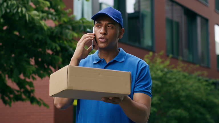 https://media.gettyimages.com/id/2178261383/video/african-american-delivery-food-post-service-man-worker-courier-in-uniform-in-city-talking.jpg?b=1&s=640x640&k=20&c=Gqom3DUaEzL2Zx_TvUzaWD-S4OK-c3xmUAuCbktobcE=