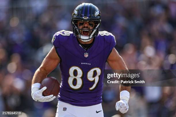 Mark Andrews of the Baltimore Ravens celebrates after catching a touchdown pass during the second quarter against the Washington Commanders at M&T...