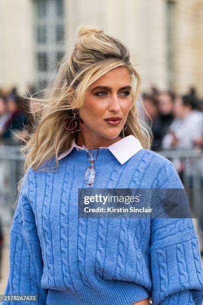 Emili Sindlev wears all Loewe with Chanel earrings and Gucci glasses outside the Loewe show during Womenswear Spring/Summer 2025 as part of Paris...
