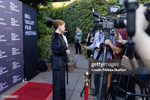 Amy Adams gives an interview at the closing night screening of "Nightbitch" during the 47th Mill Valley Film Festival at The Outdoor Art Club on...