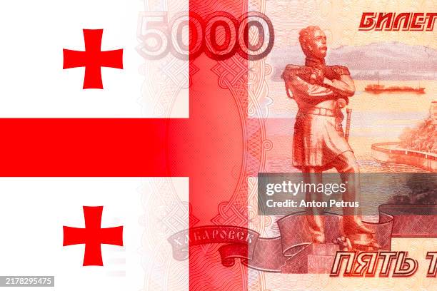 russian ruble banknote and georgian flag - georgia flag stock pictures, royalty-free photos & images
