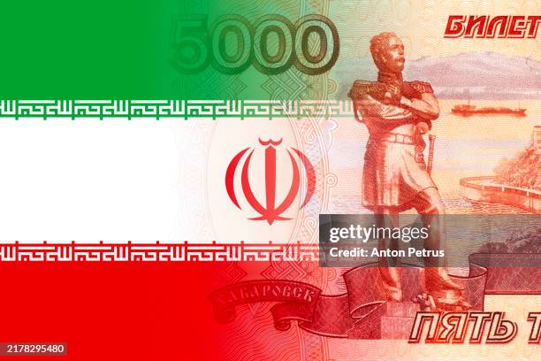 russian ruble banknote and iranian flag - iran military stock pictures, royalty-free photos & images