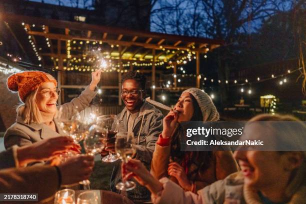 cheers to the new year! - silvester stock-fotos und bilder