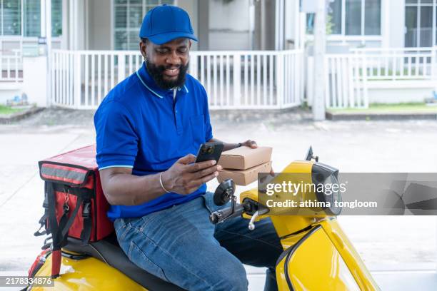 African Delivery Rider 123 African Delivery Motorbike Stock Photos, High-Res Pictures, and ...