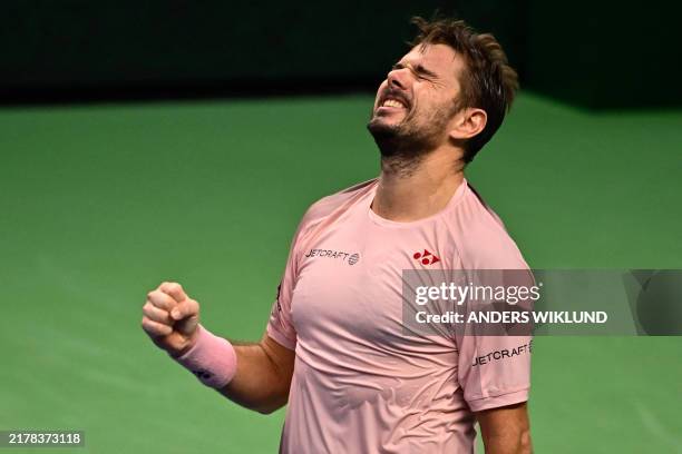Switzerland's Stan Wawrinka celebrates after winning against Andrey Rublev, of Russian origin and playing under neutral flag, during the...