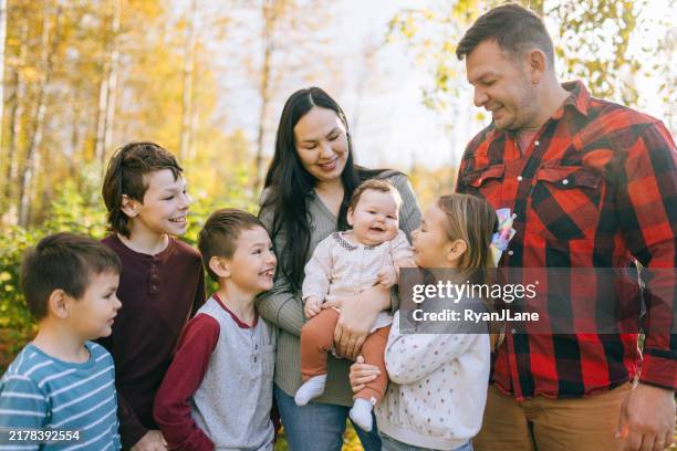 cute multiracial family at home in alaska - indigenous stock pictures, royalty-free photos & images