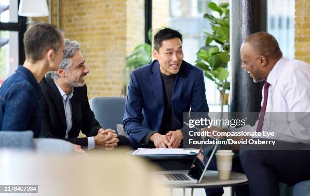 business colleagues having meeting - differential focus stock pictures, royalty-free photos & images