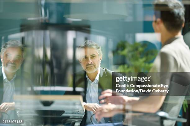 business colleagues having meeting - image focus technique stock pictures, royalty-free photos & images